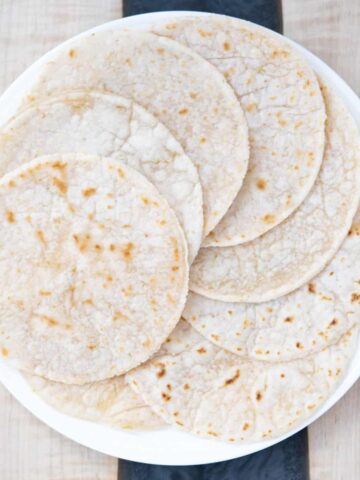 cassava flour tortillas with lime on a dish.