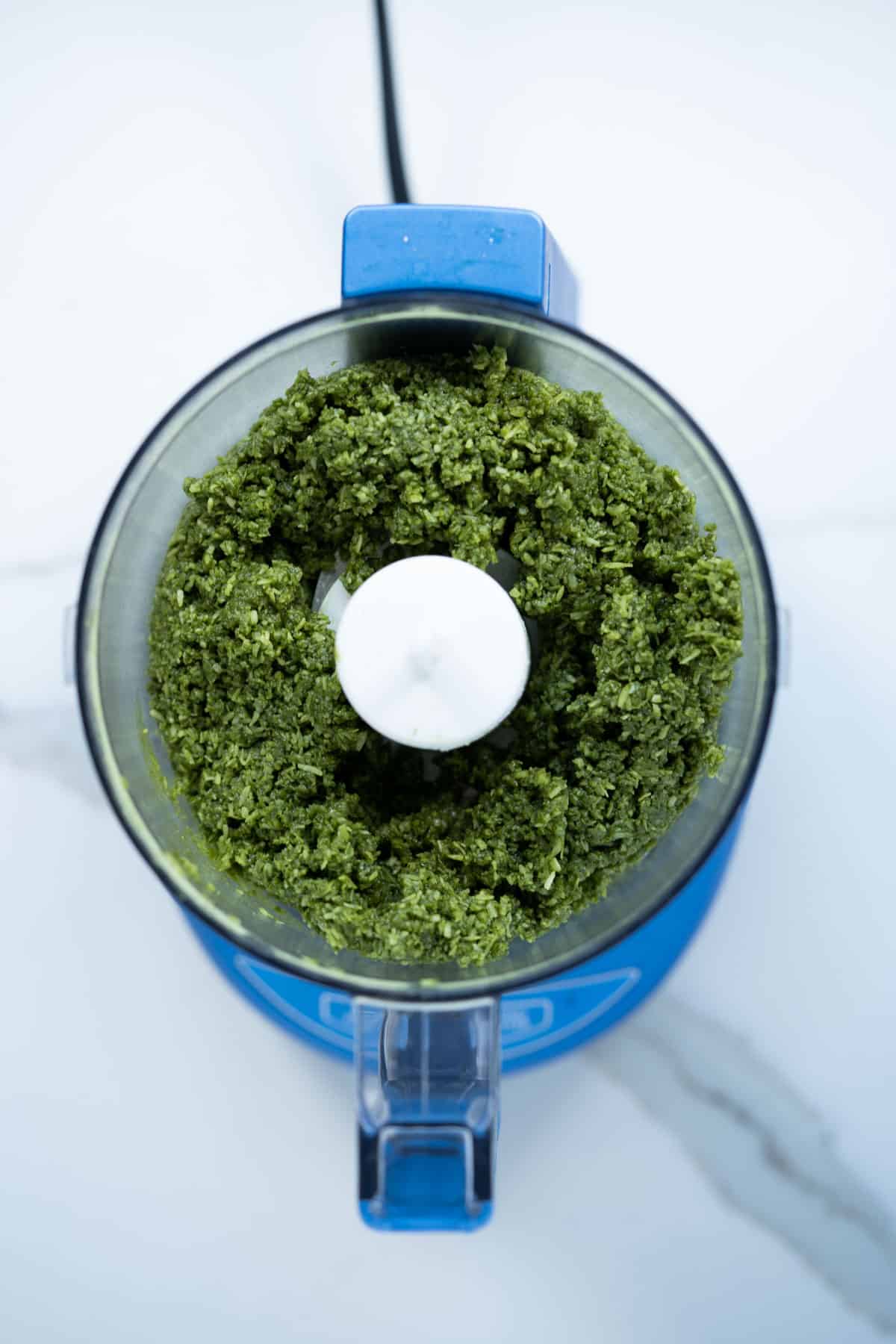 Ingredients for healthy energy bites mixed in food processor