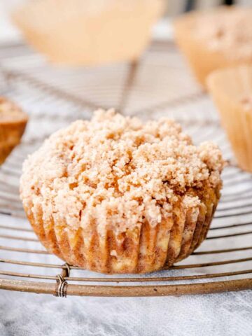 baked ginger apple muffins on round cooling rack