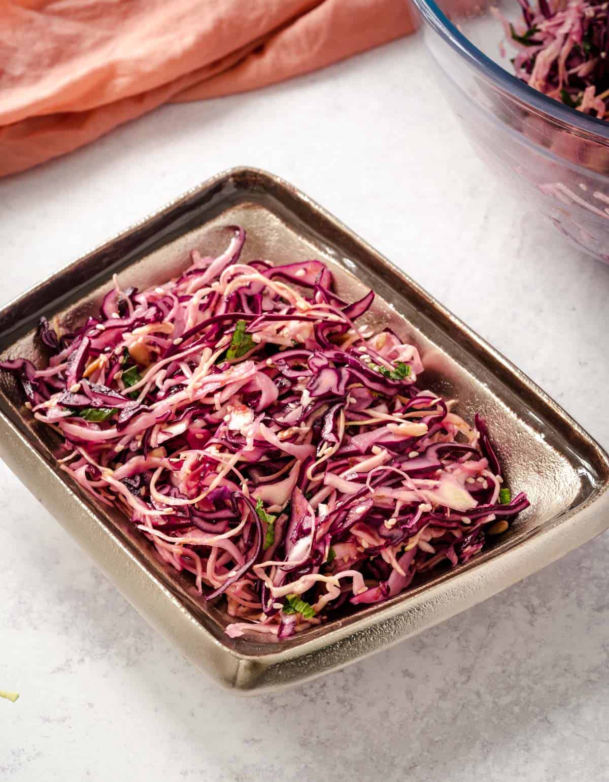 crunch cabbage salad in a metalic dish