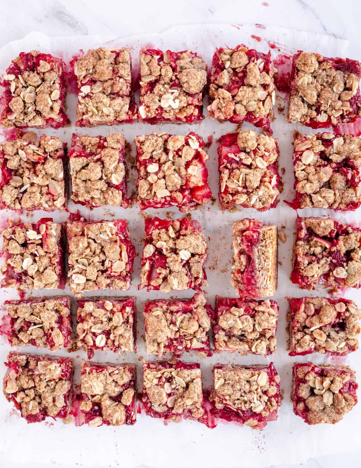 strawberry oat bars cut in squares.