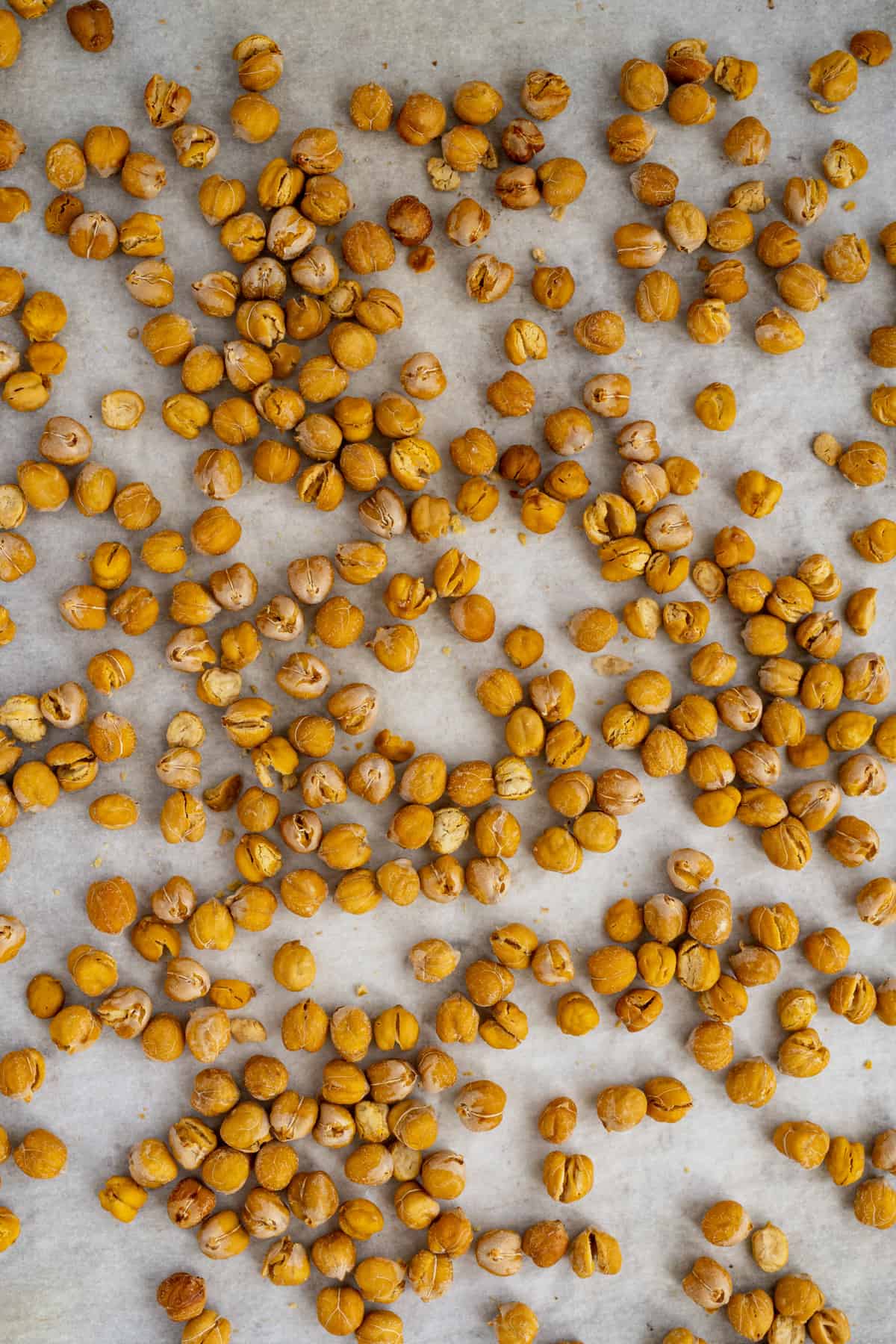 baked chickpeas spread on parchment.