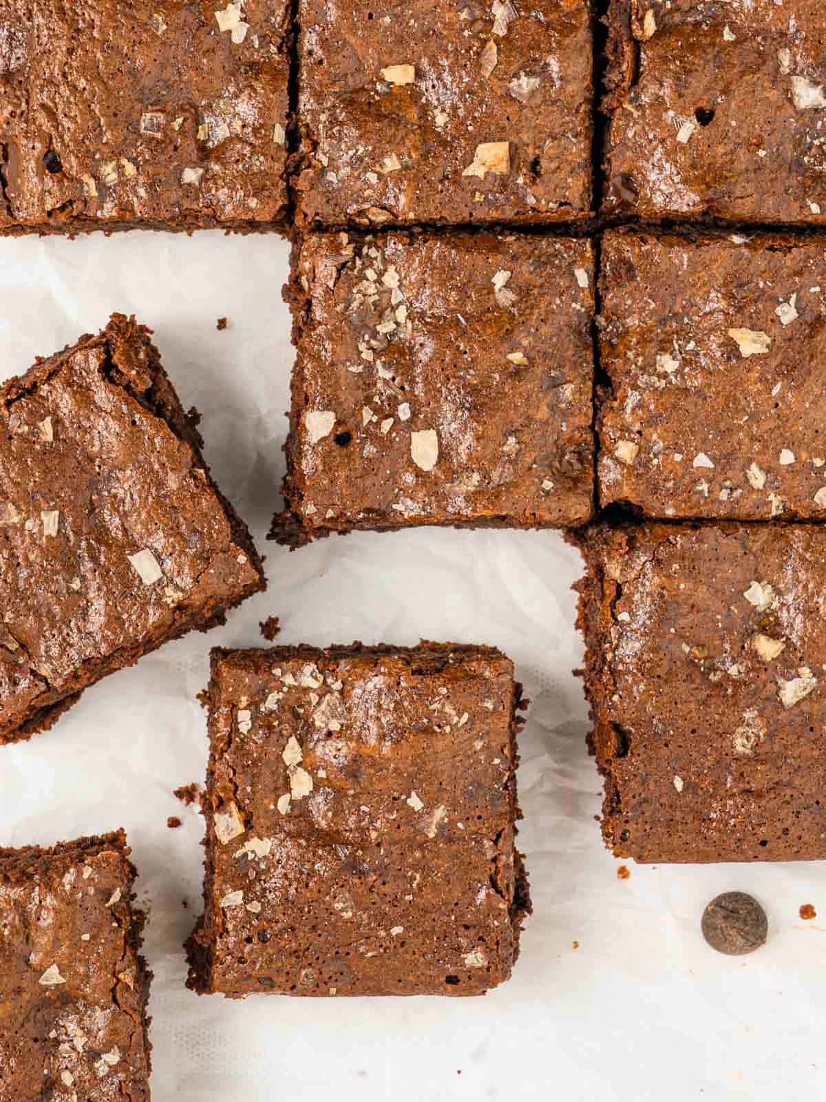 almond flour brownies cut into squares with a few chocolate chips on the side.